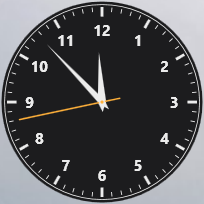The Analog Clock tile: a clock face with hands, on a clear theme.